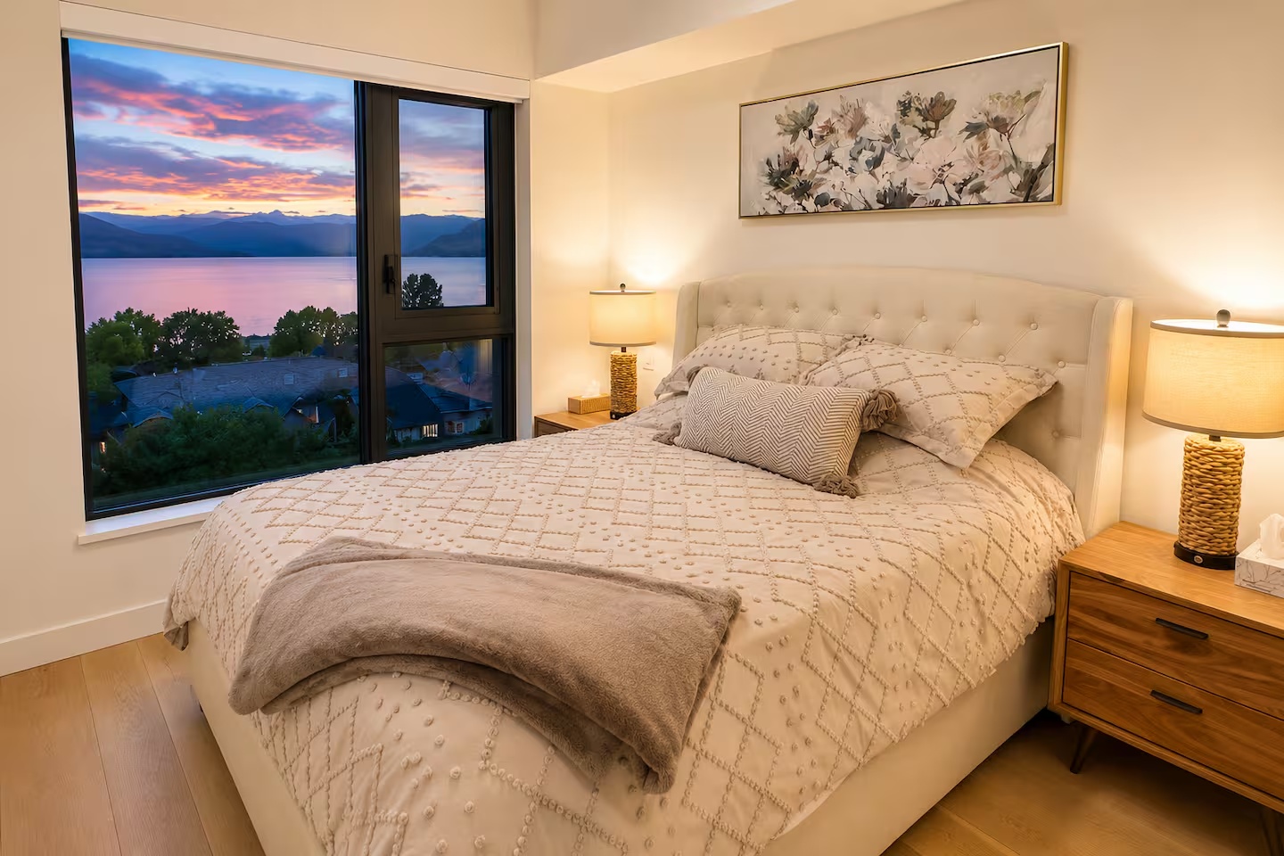 Bright primary bedroom with lake view